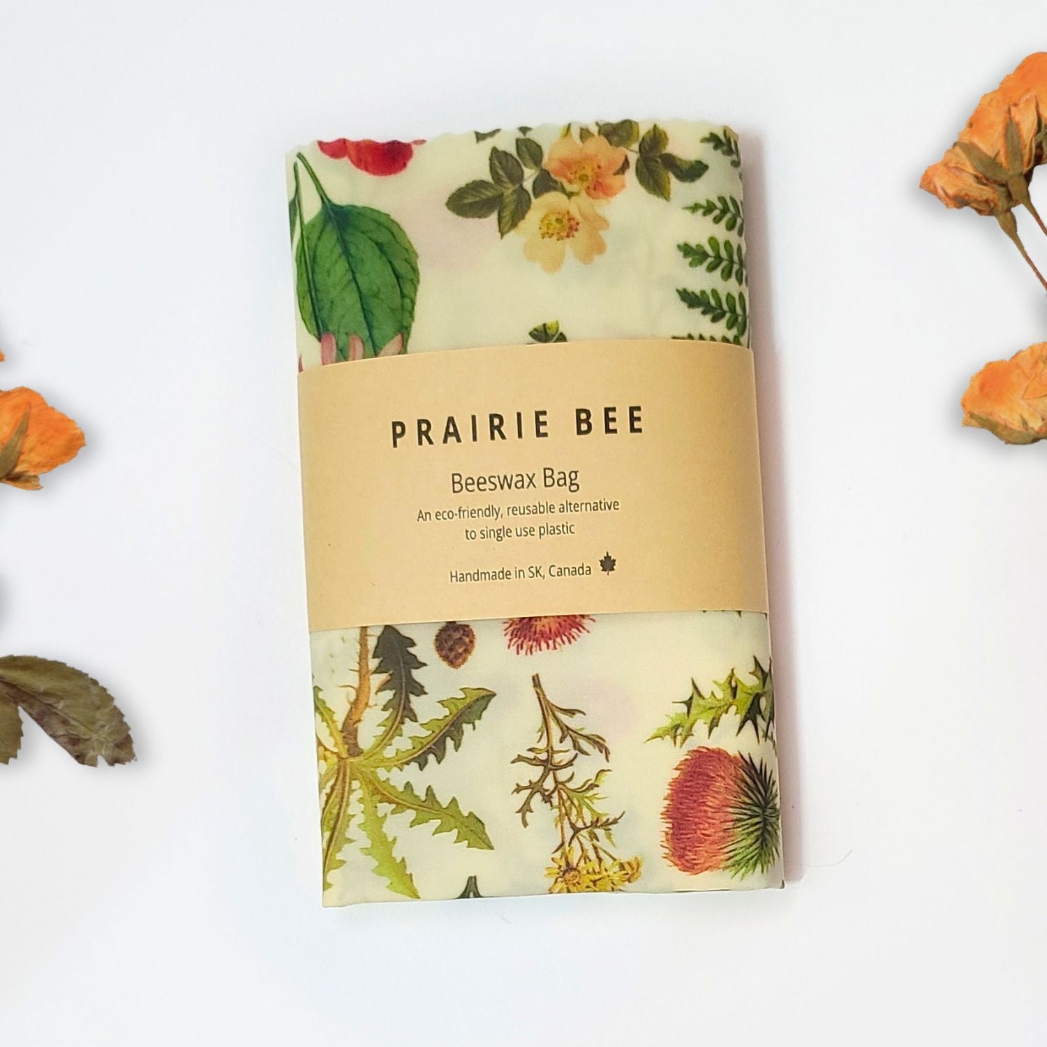 Prairie Bee beeswax bag with floral pattern on a white background