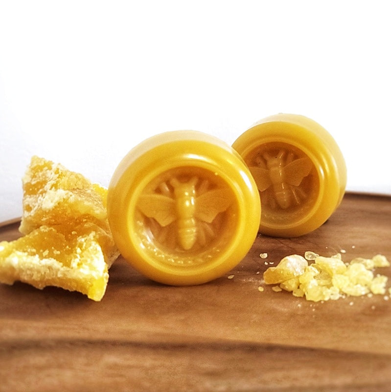 Yellow beeswax wraps pucks to resfresh wraps.