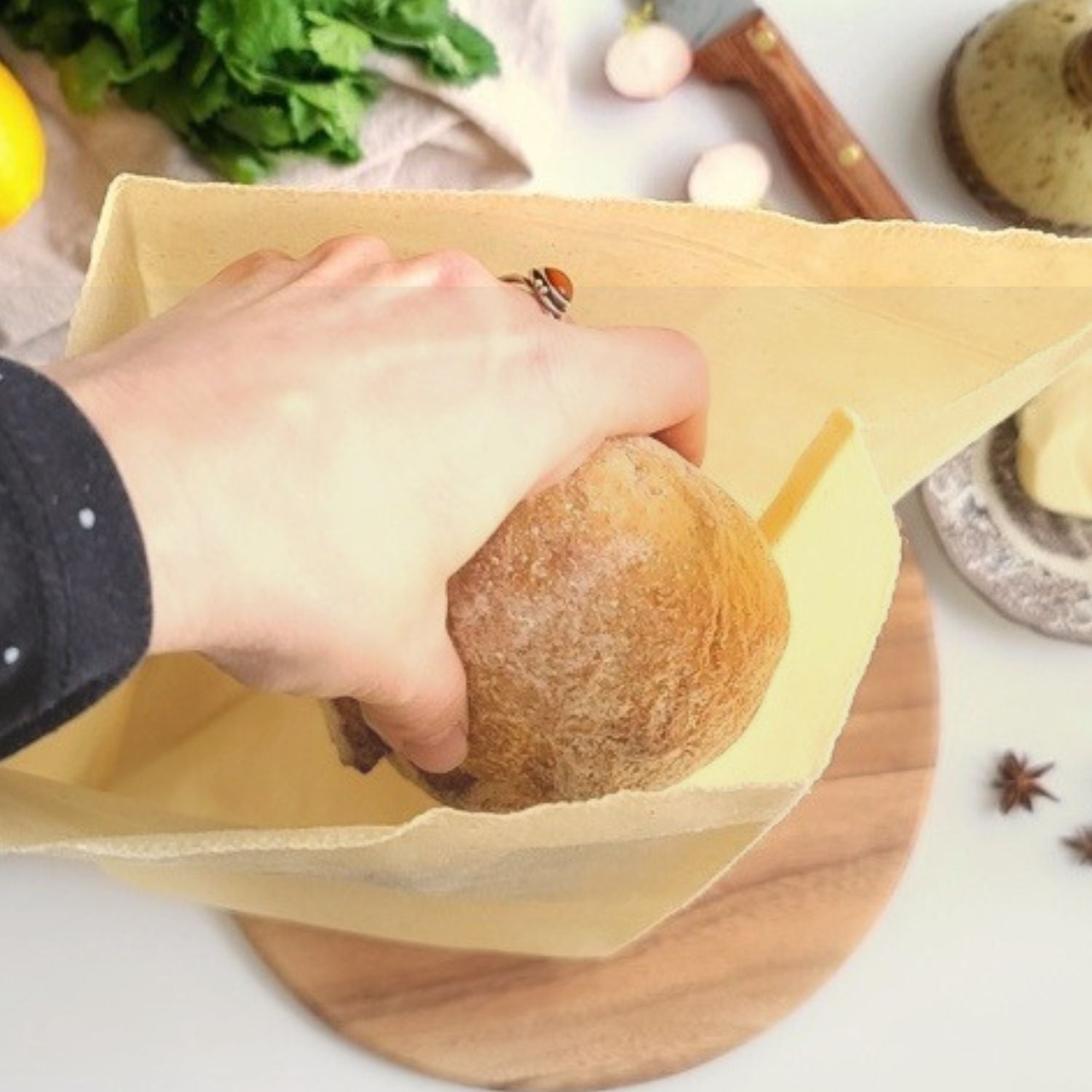 Placing a loaf of bread in a beeswax bag